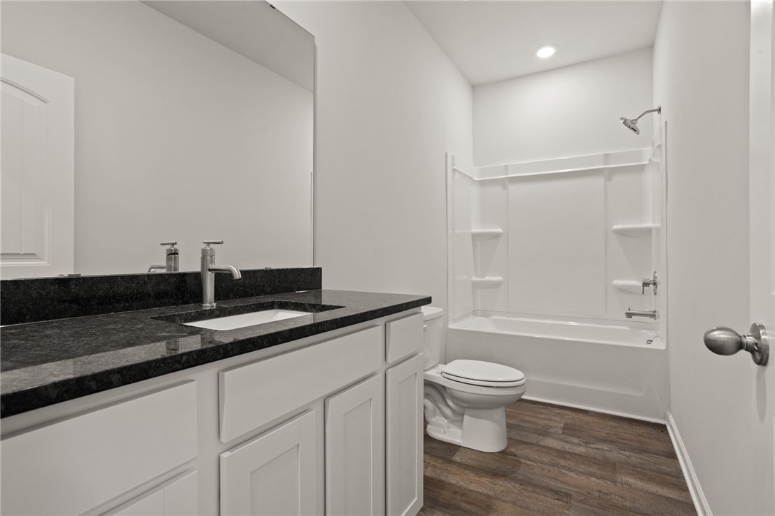 629 Silver Fir Street Piedmont, SC 29673 - Photo 8 of 36 This modern bathroom features a sleek vanity and a classic tub and shower combination.