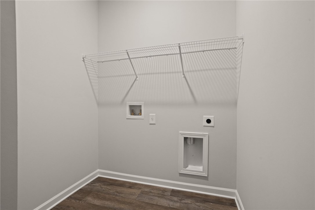 629 Silver Fir Street Piedmont, SC 29673 - Photo 9 of 36 This dedicated laundry space offers convenience and functionality with essential hookups and practical storage.