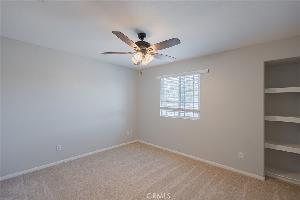 40601 Cebu Street Temecula, CA 92591 - Photo 20 of 26 an empty room with windows and fan