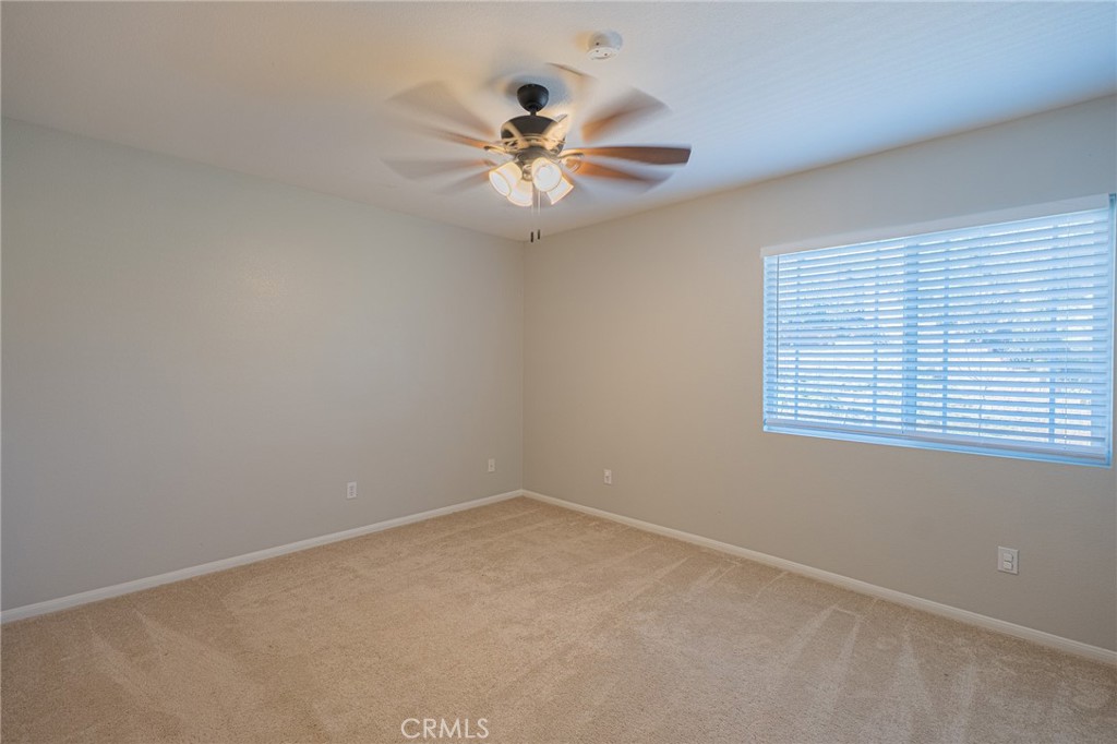 40601 Cebu Street Temecula, CA 92591 - Photo 21 of 26 an empty room with a window and a fan