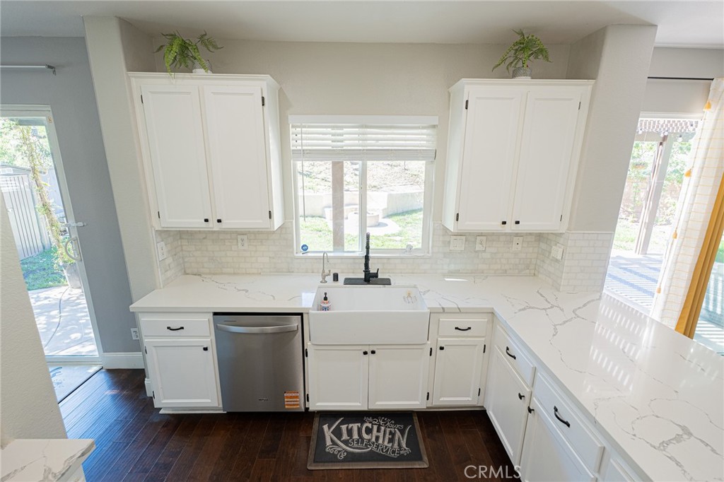 40601 Cebu Street Temecula, CA 92591 - Photo 10 of 26 a view of a kitchen with appliances cabinets and a large window