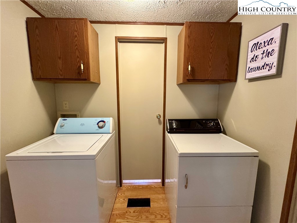 496 Laurelwood Lane Boone, NC 28607 - Photo 17 of 45 a utility room with dryer and washer