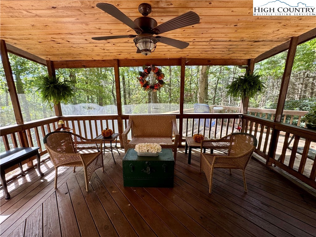 496 Laurelwood Lane Boone, NC 28607 - Photo 24 of 45 an outdoor view of a house with wooden floor outdoor seating