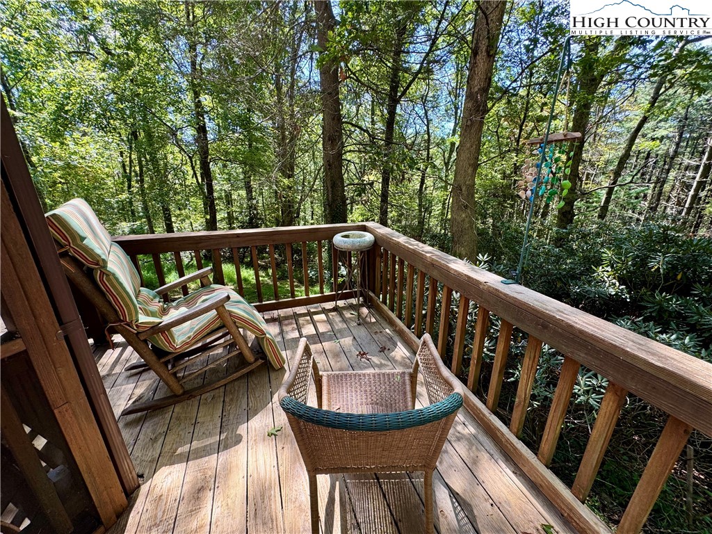 496 Laurelwood Lane Boone, NC 28607 - Photo 27 of 45 a view of a balcony with wooden floor and furniture