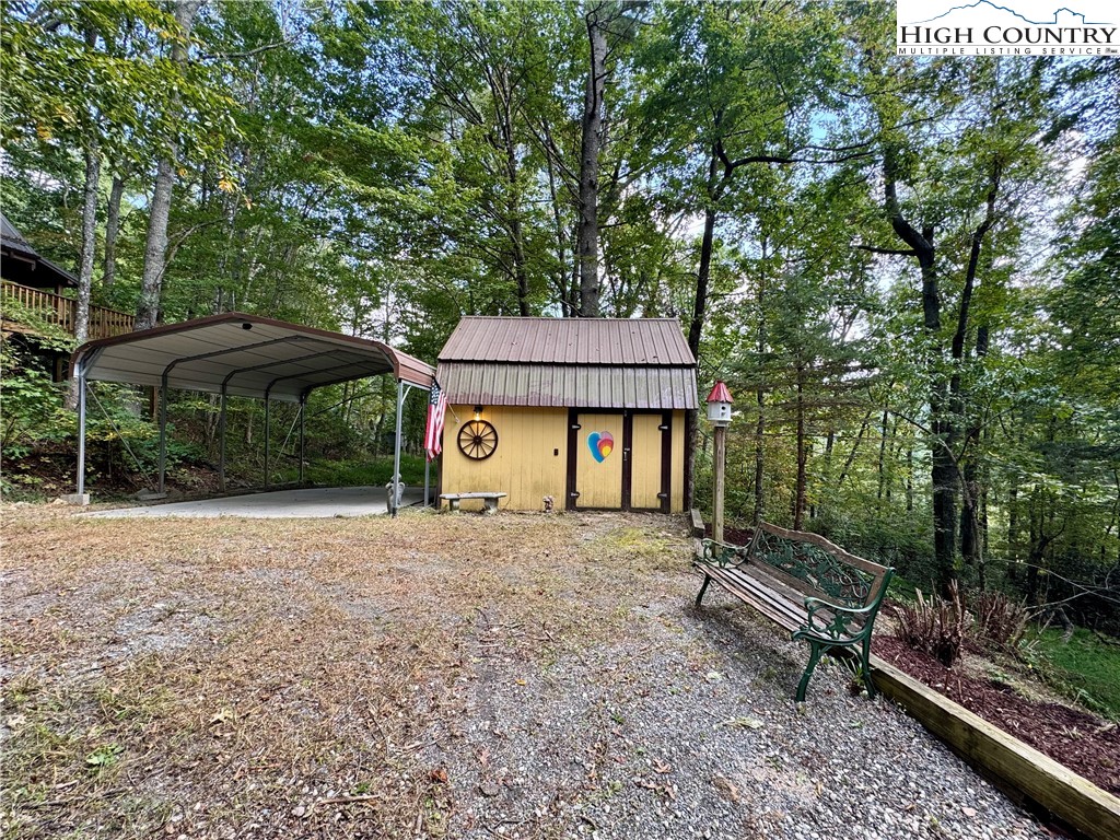 496 Laurelwood Lane Boone, NC 28607 - Photo 34 of 45 a view of a house with backyard and sitting area