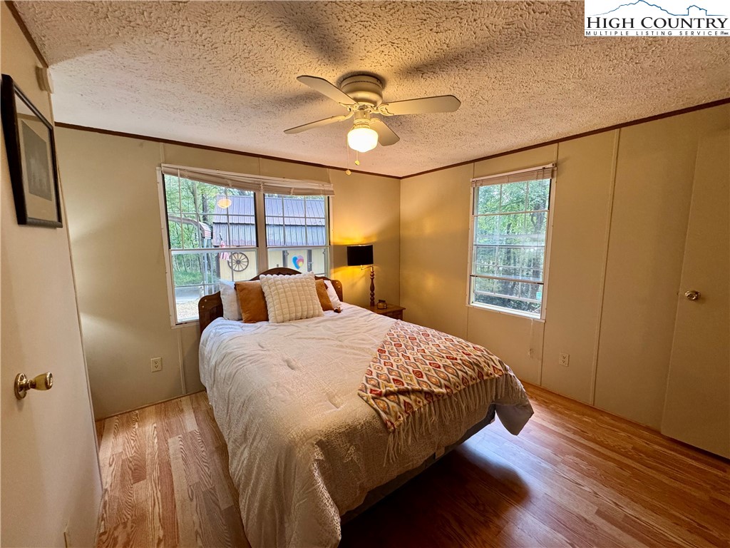 496 Laurelwood Lane Boone, NC 28607 - Photo 10 of 45 a bed sitting in a bedroom next to a window