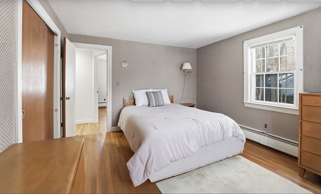 49 Jackson Road Scituate, MA 02066 - Photo 13 of 25 a bedroom with a bed and window
