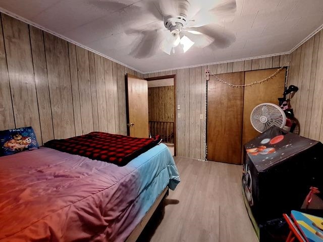 200 Oregon Street Troy Grove, IL 61372 - Photo 22 of 34 a bedroom with a bed and a chandelier