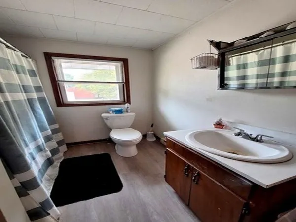 a view of entryway with wooden floor