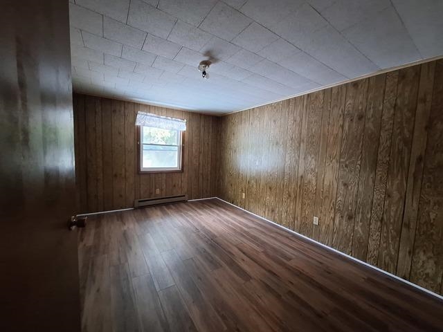 200 Oregon Street Troy Grove, IL 61372 - Photo 29 of 34 an empty room with wooden floor and windows
