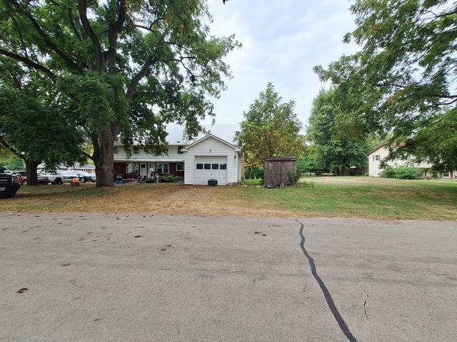 200 Oregon Street Troy Grove, IL 61372 - Photo 34 of 34 a front view of a house with a yard and garage