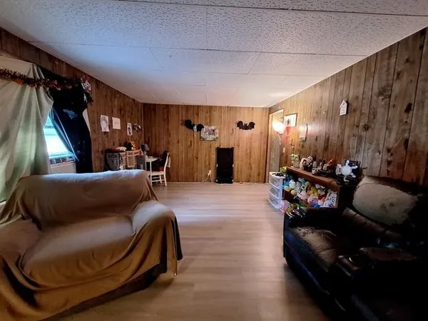 a living room with lots of furniture and a flat screen tv