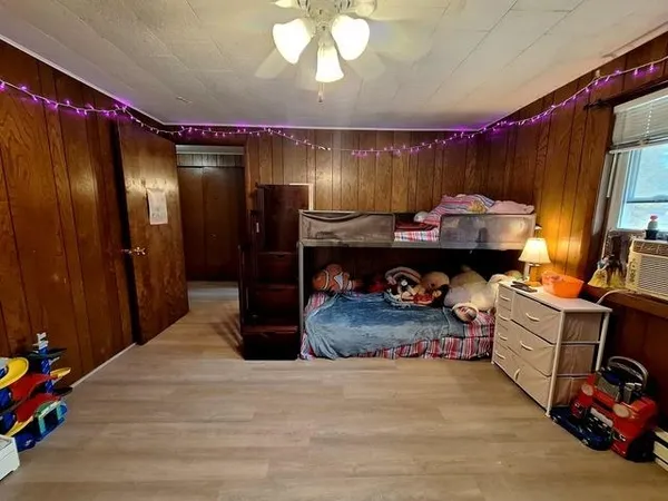 a view of a livingroom with furniture and a flat screen tv