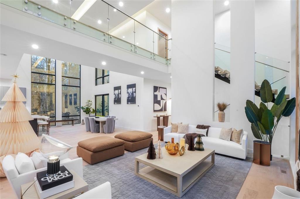1736 Cox Road Roswell, GA 30075 - Photo 12 of 92 a living room with furniture a rug and a chandelier