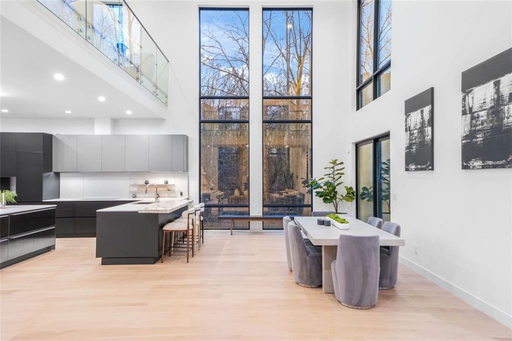 1736 Cox Road Roswell, GA 30075 - Photo 17 of 92 a living room with furniture a chandelier and a flat screen tv