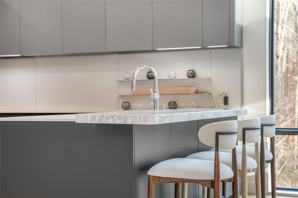 1736 Cox Road Roswell, GA 30075 - Photo 24 of 92 a kitchen with a sink cabinets and window