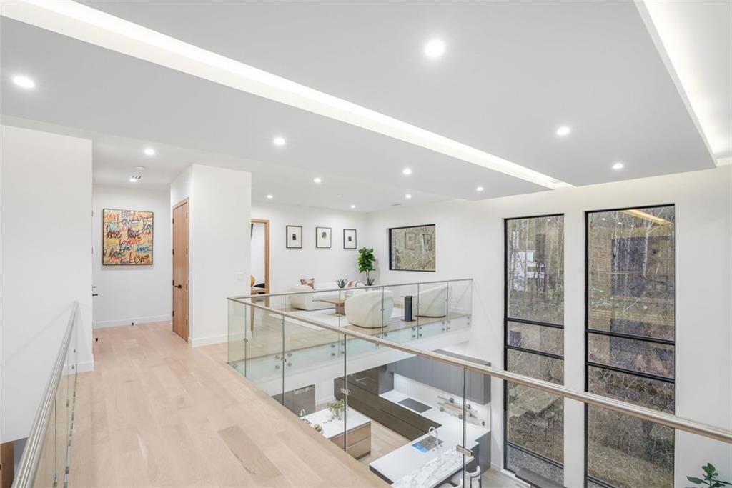 1736 Cox Road Roswell, GA 30075 - Photo 56 of 92 a living room with furniture a large window and stainless steel appliances