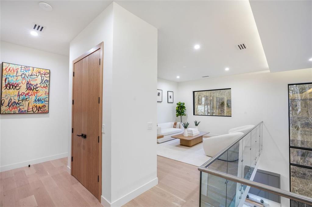 1736 Cox Road Roswell, GA 30075 - Photo 57 of 92 a living room with furniture and wooden floor