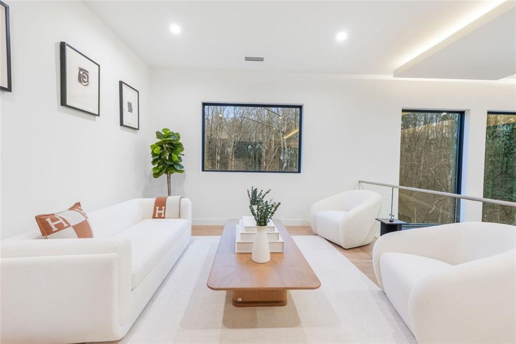 1736 Cox Road Roswell, GA 30075 - Photo 59 of 92 a living room with furniture and a large window