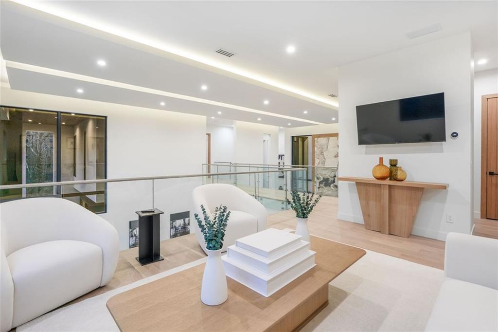 1736 Cox Road Roswell, GA 30075 - Photo 61 of 92 a living room with furniture and a flat screen tv