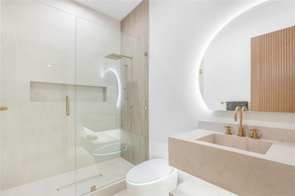 1736 Cox Road Roswell, GA 30075 - Photo 78 of 92 a bathroom with a sink toilet and shower