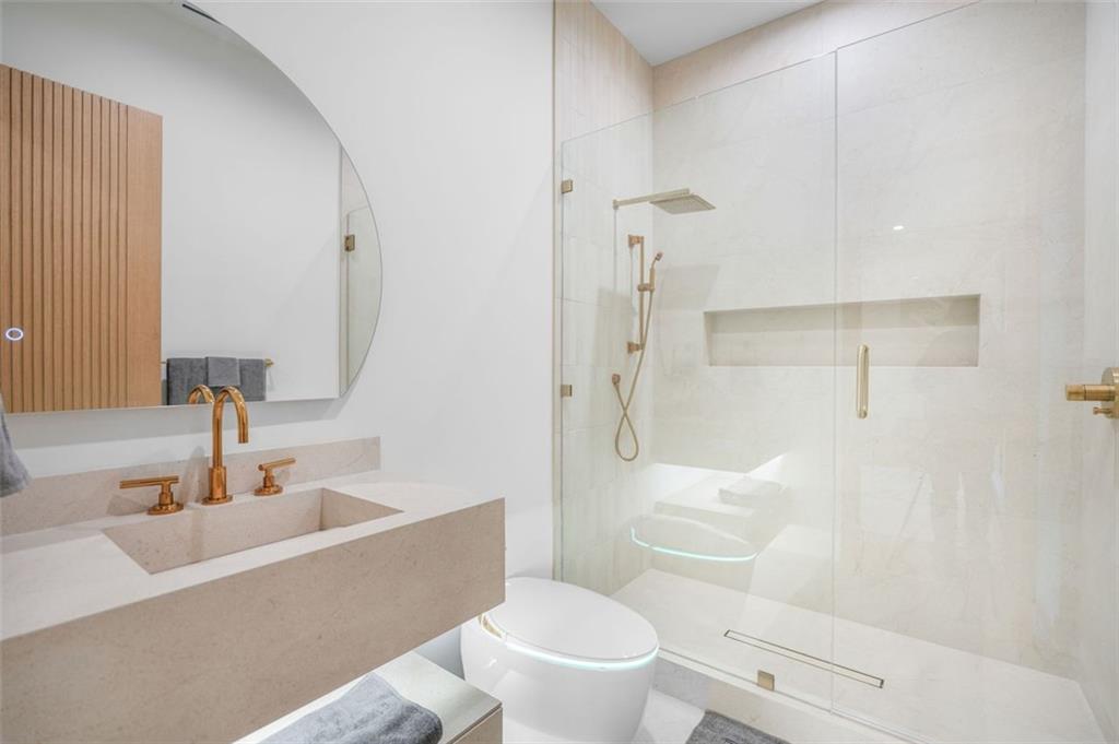 1736 Cox Road Roswell, GA 30075 - Photo 83 of 92 a bathroom with a sink toilet vanity and shower