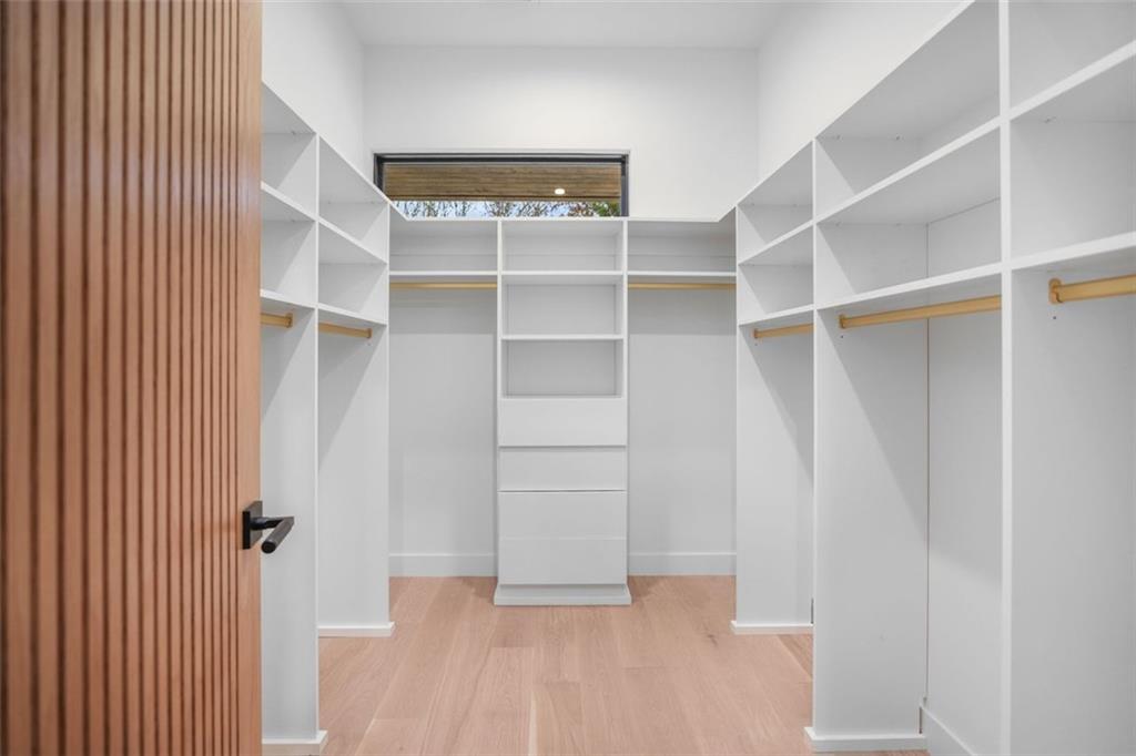 1736 Cox Road Roswell, GA 30075 - Photo 84 of 92 a view of walk in closet with empty racks