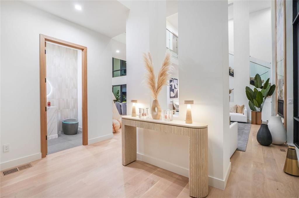 1736 Cox Road Roswell, GA 30075 - Photo 9 of 92 a view of living room filled with furniture and potted plant