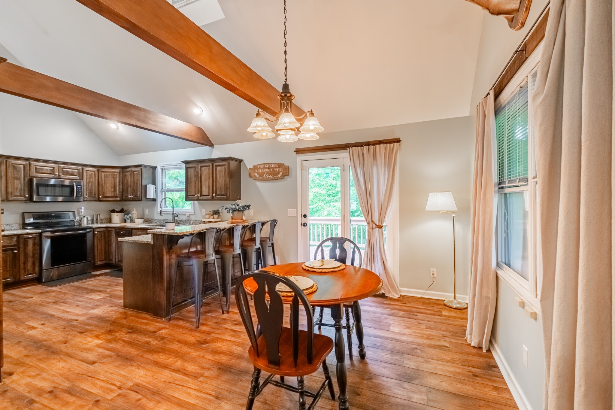 255 Flora Lane Manchester, TN 37355 - Photo 13 of 53 a open kitchen with a table and chairs in it