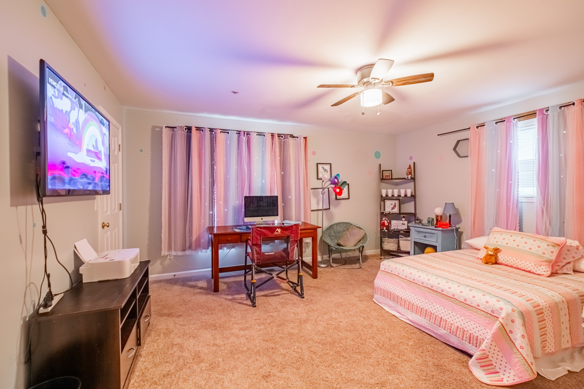 255 Flora Lane Manchester, TN 37355 - Photo 22 of 53 a bedroom with a bed and a chandelier