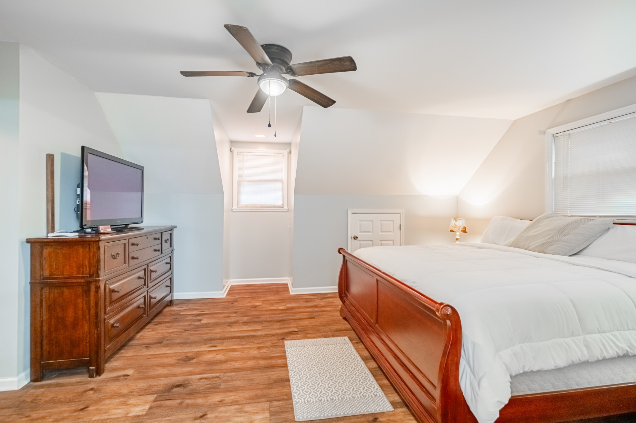 255 Flora Lane Manchester, TN 37355 - Photo 28 of 53 a spacious bedroom with a bed and wooden floor