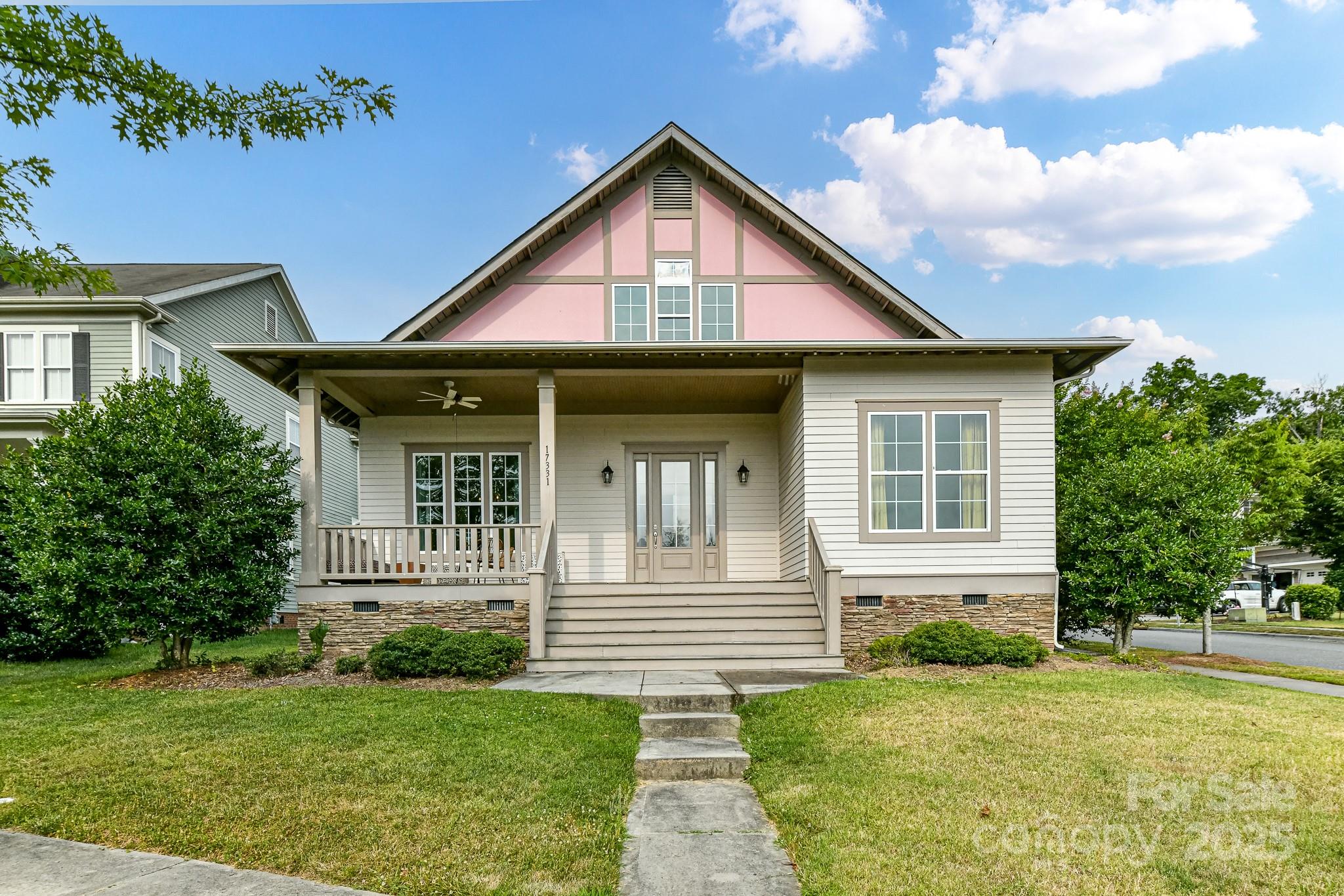 a front view of a house with garden