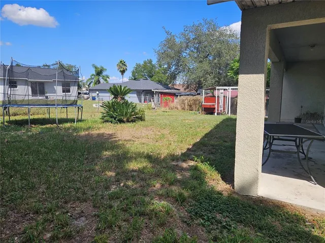a view of a house with a back yard