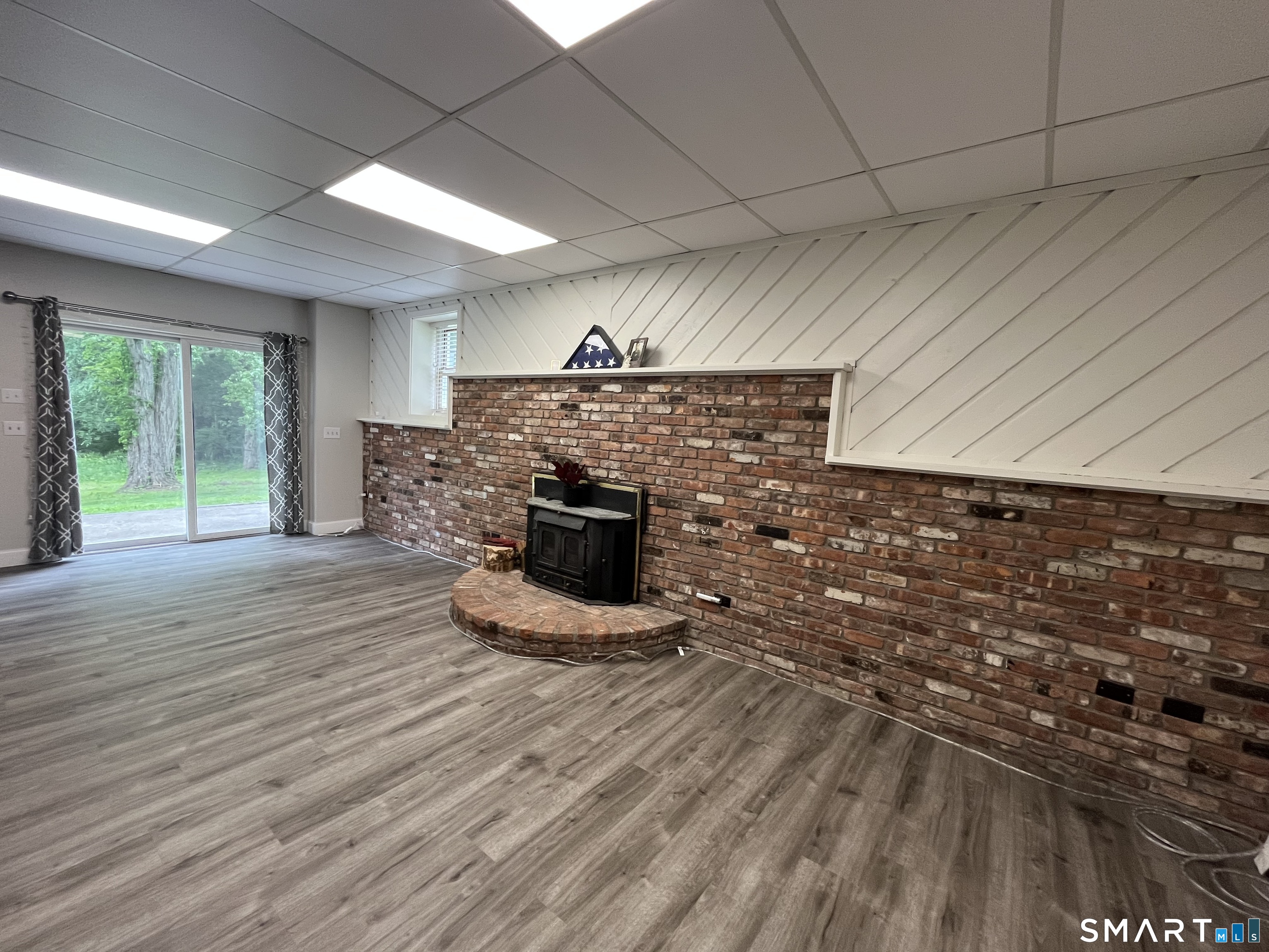 47 Merwin Brook Road Brookfield, CT 06804 - Photo 21 of 29 Full walkout brings natural light and beautiful views directly into this level of this home.