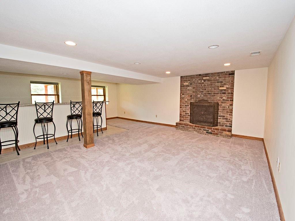 297 McKee Road Washington, PA 15301 - Photo 16 of 19 Spacious basement with a wet bar and gas fireplace.