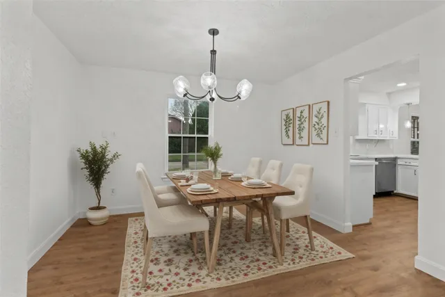 a dining room with furniture and window