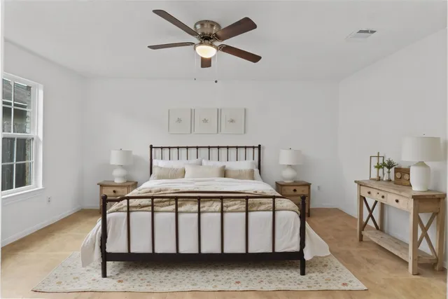 a kitchen with stainless steel appliances a sink cabinets and wooden floor