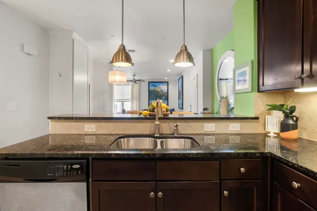 a kitchen with a sink and wooden cabinets