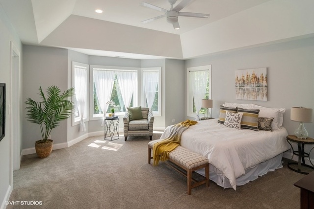 204 Fairbank Road Riverside, IL 60546 - Photo 11 of 24 a spacious bedroom with a bed and a couch