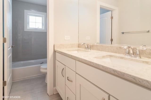 204 Fairbank Road Riverside, IL 60546 - Photo 20 of 24 a bathroom with a granite countertop sink toilet and shower