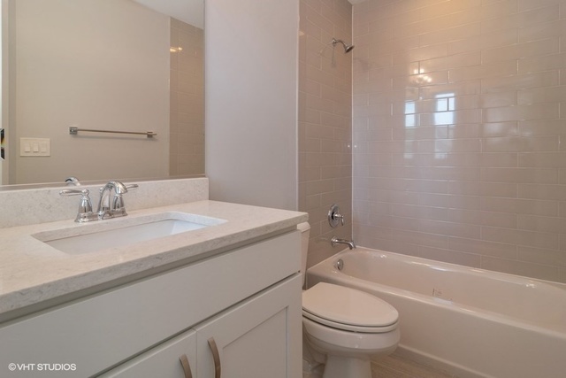 204 Fairbank Road Riverside, IL 60546 - Photo 21 of 24 a bathroom with a granite countertop sink a toilet and shower