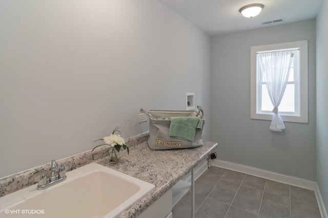 204 Fairbank Road Riverside, IL 60546 - Photo 22 of 24 a bathroom with a granite countertop sink and a vanity