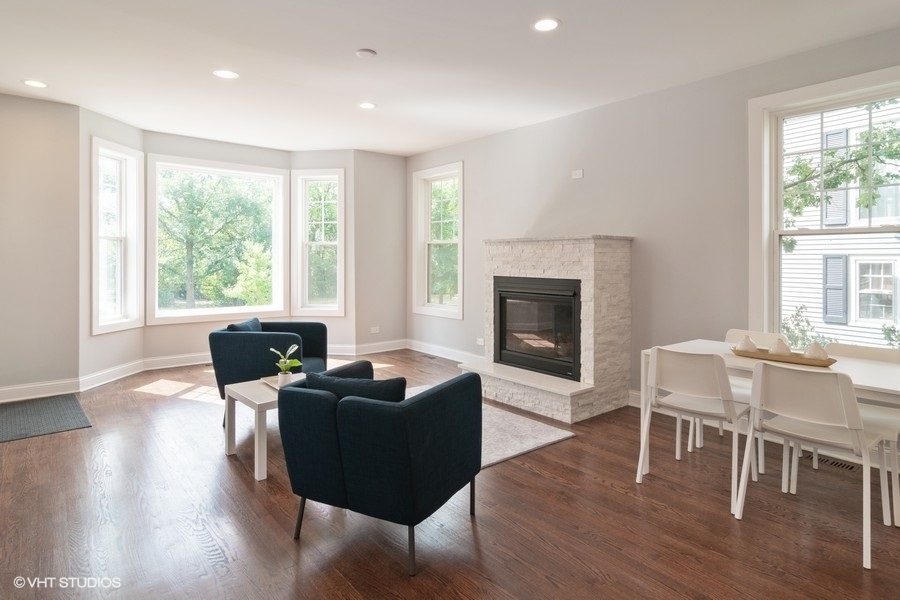 204 Fairbank Road Riverside, IL 60546 - Photo 4 of 24 a living room with furniture wooden floor and a fireplace