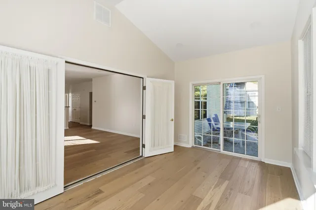 an aerial view of a house with a swimming pool and garden