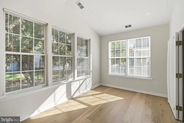 an aerial view of residential houses with outdoor space and swimming pool
