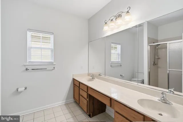 an aerial view of a house with a swimming pool outdoor seating and yard