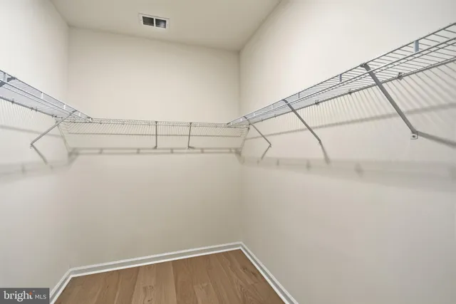 an aerial view of residential houses with outdoor space and lake view