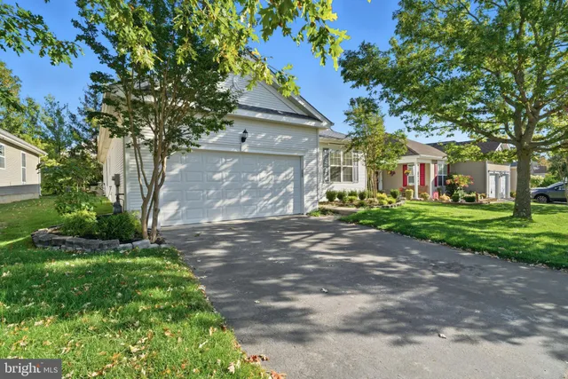 a kitchen with stainless steel appliances granite countertop a refrigerator sink and cabinets