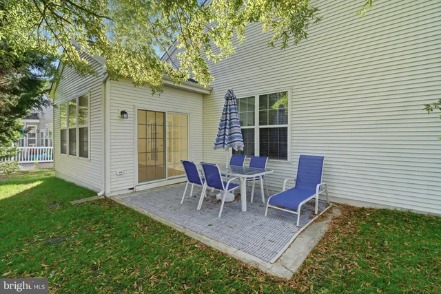 a kitchen with sink cabinets and wooden floor