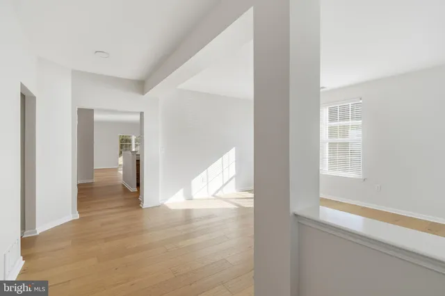 an aerial view of a house with a yard and garden